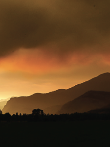 wildfire smoke seen above hllls