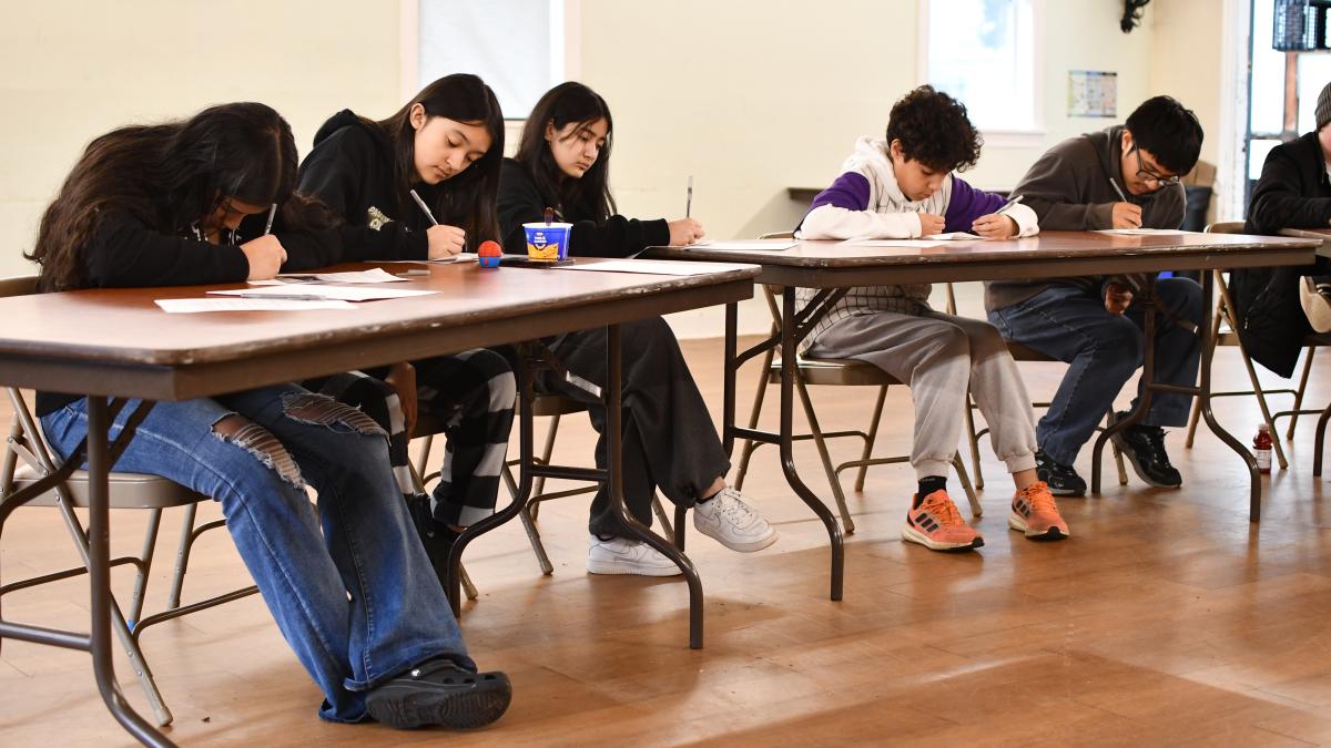 Students working at tables