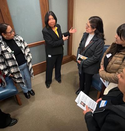 A group of people meet with Representative Debra Lekanoff