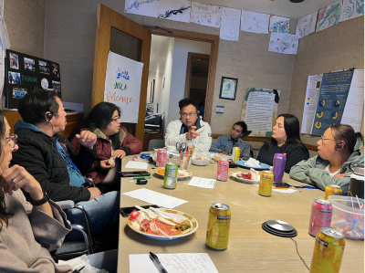 A group of people meets in the DRCC conference room.